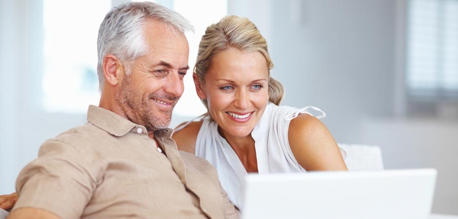 older couple looking at a laptop